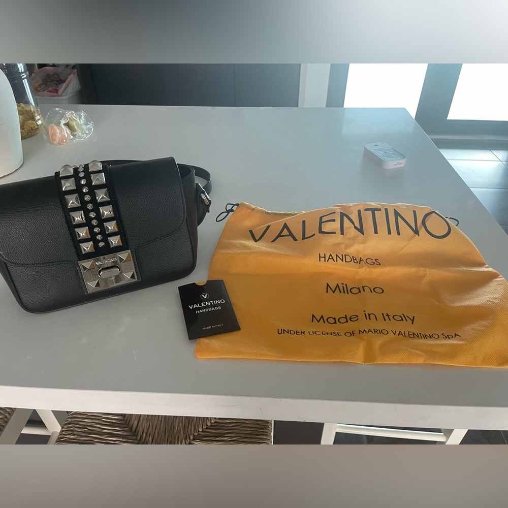 Beautiful Valentino black cross body bag .